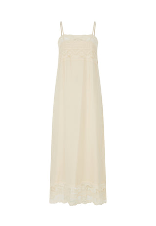  paired with brown strappy flat sandals in a bright