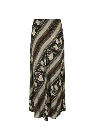 A woman modeling a two-piece bohemian maxi set with a black